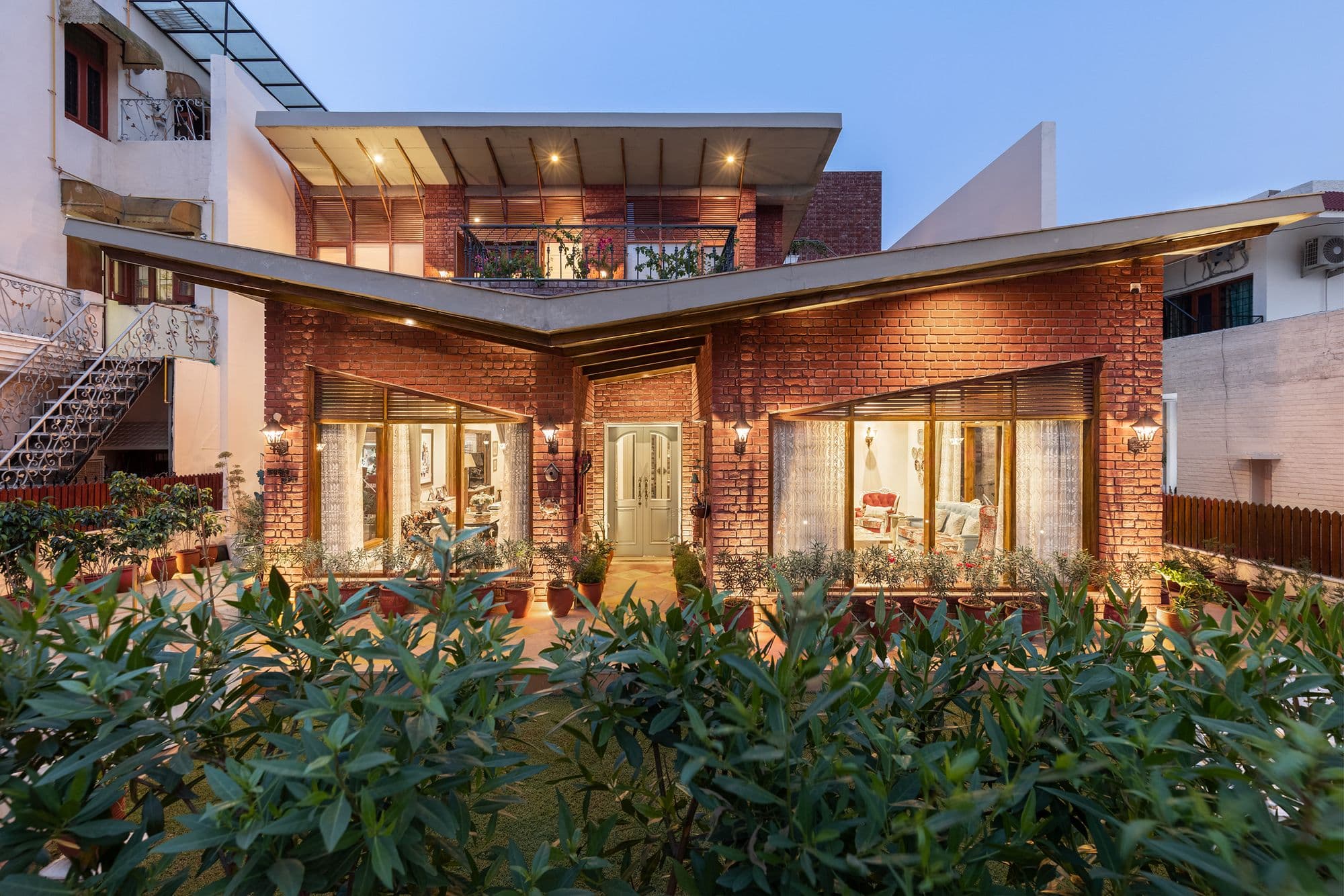 This Habitat in Chandigarh With An Inverted Sloping Roof Stands Out For Its Interesting Facade