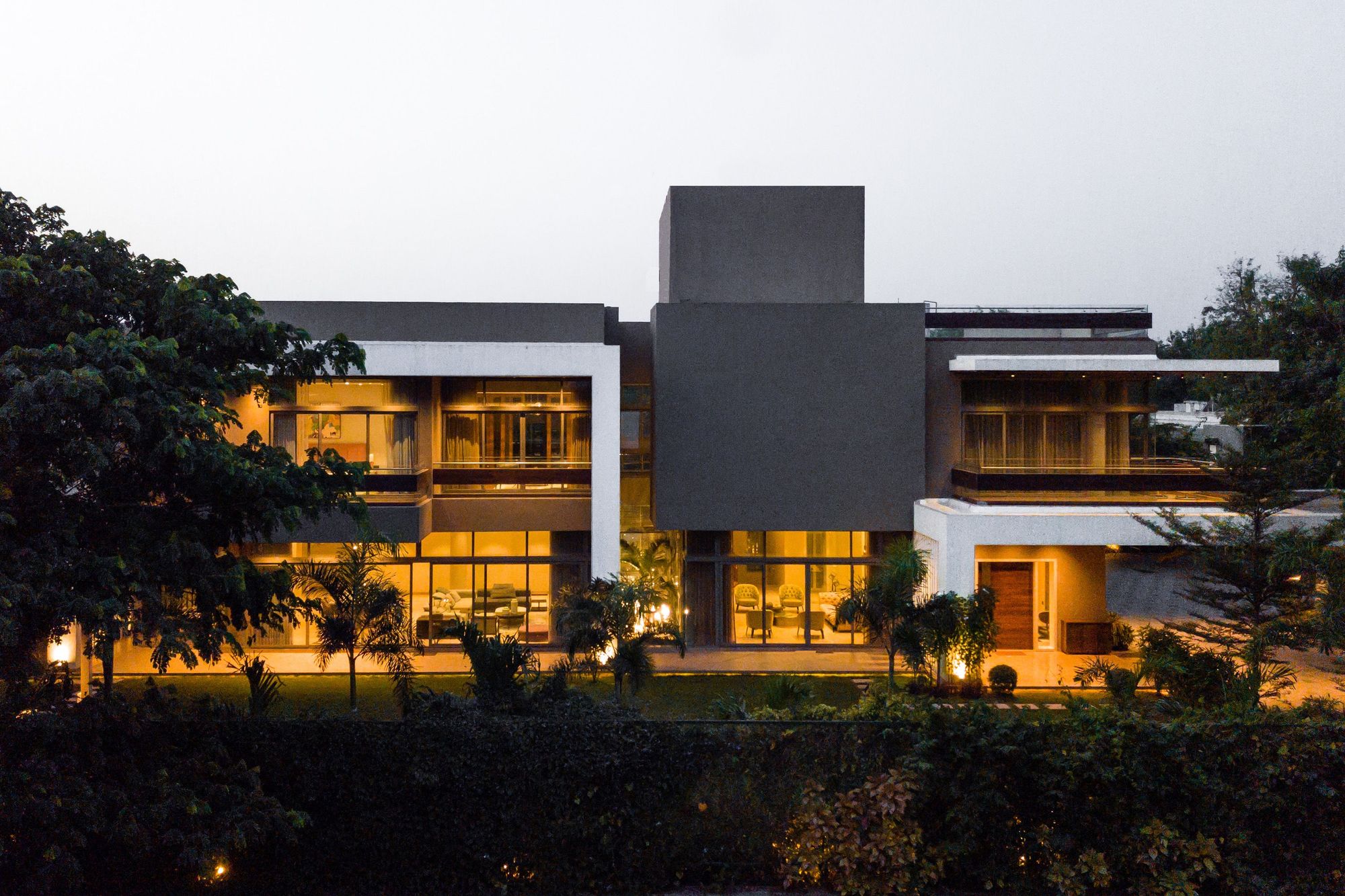 Nestled amidst dense greenery, this villa mindfully tackles the extreme climate of Ahmedabad