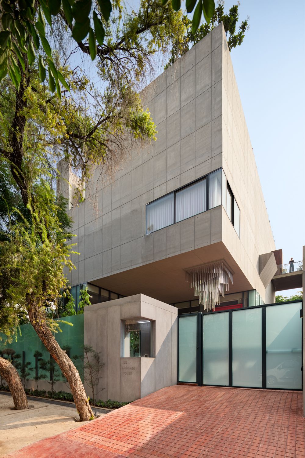 Archohm’s concrete home in Noida is designed to hang, redefining standards of luxury