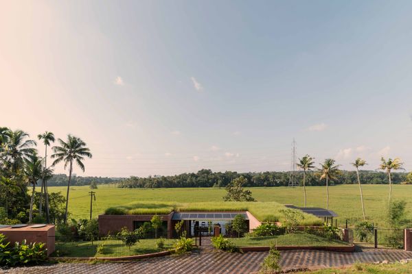 Green Roof, Local Material, and Blurred Boundaries Assemble in this Kerala Home